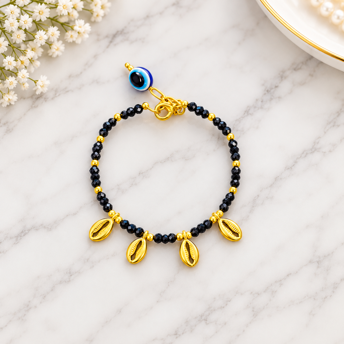 Black Beaded Evil Eye Bracelet with Gold Cowrie Shell Charms