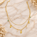 Gold-Tone Double-Layer Charm Necklace – Turquoise, Pearl & Leaf Pendant Chain